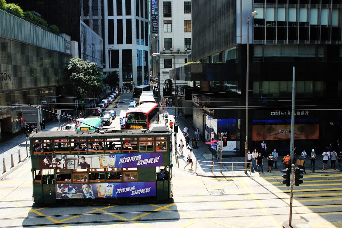Double-decker tram passing through Central business district in Hong Kong
