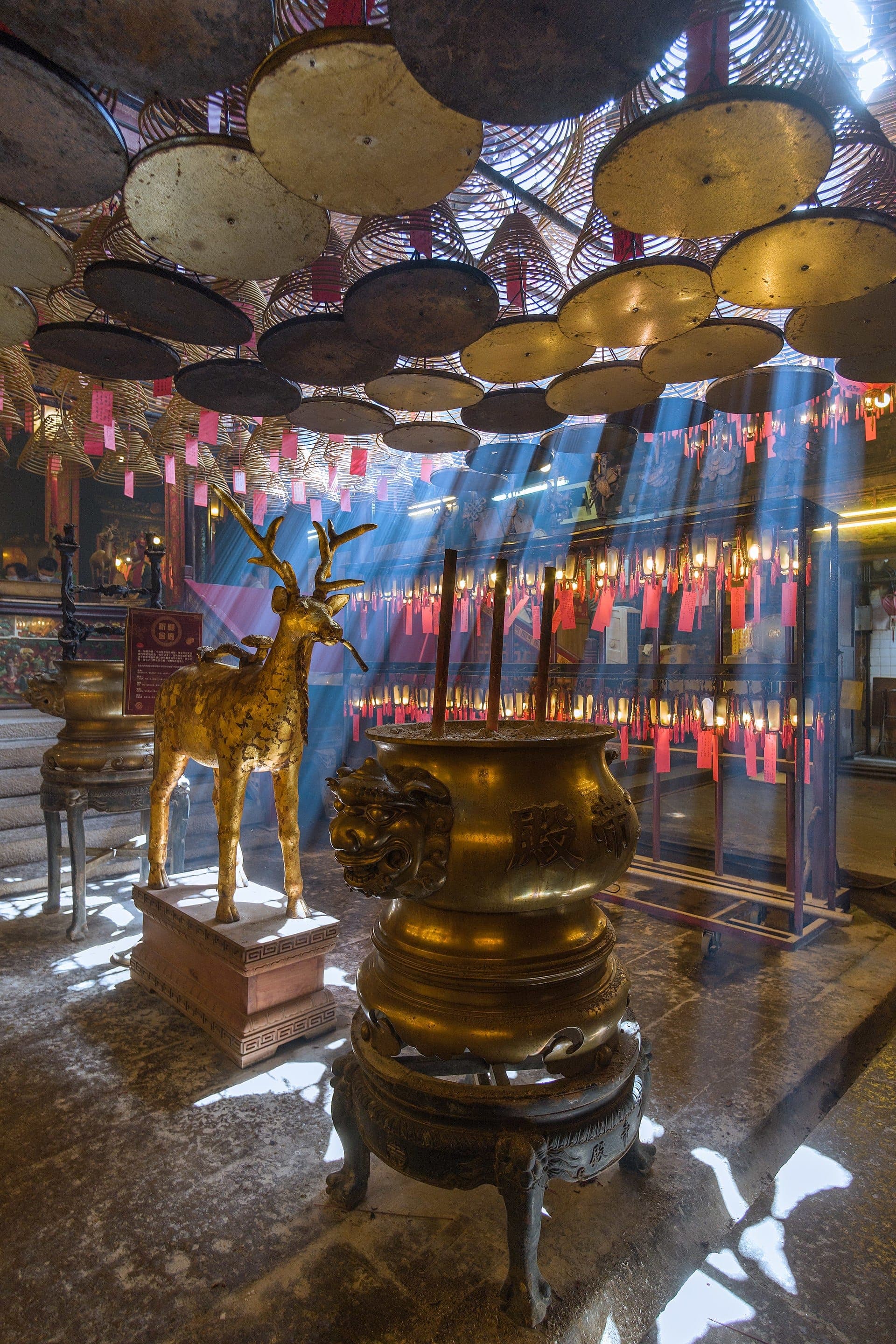 Incense coils and golden altar inside Man Mo Temple, Hong Kong