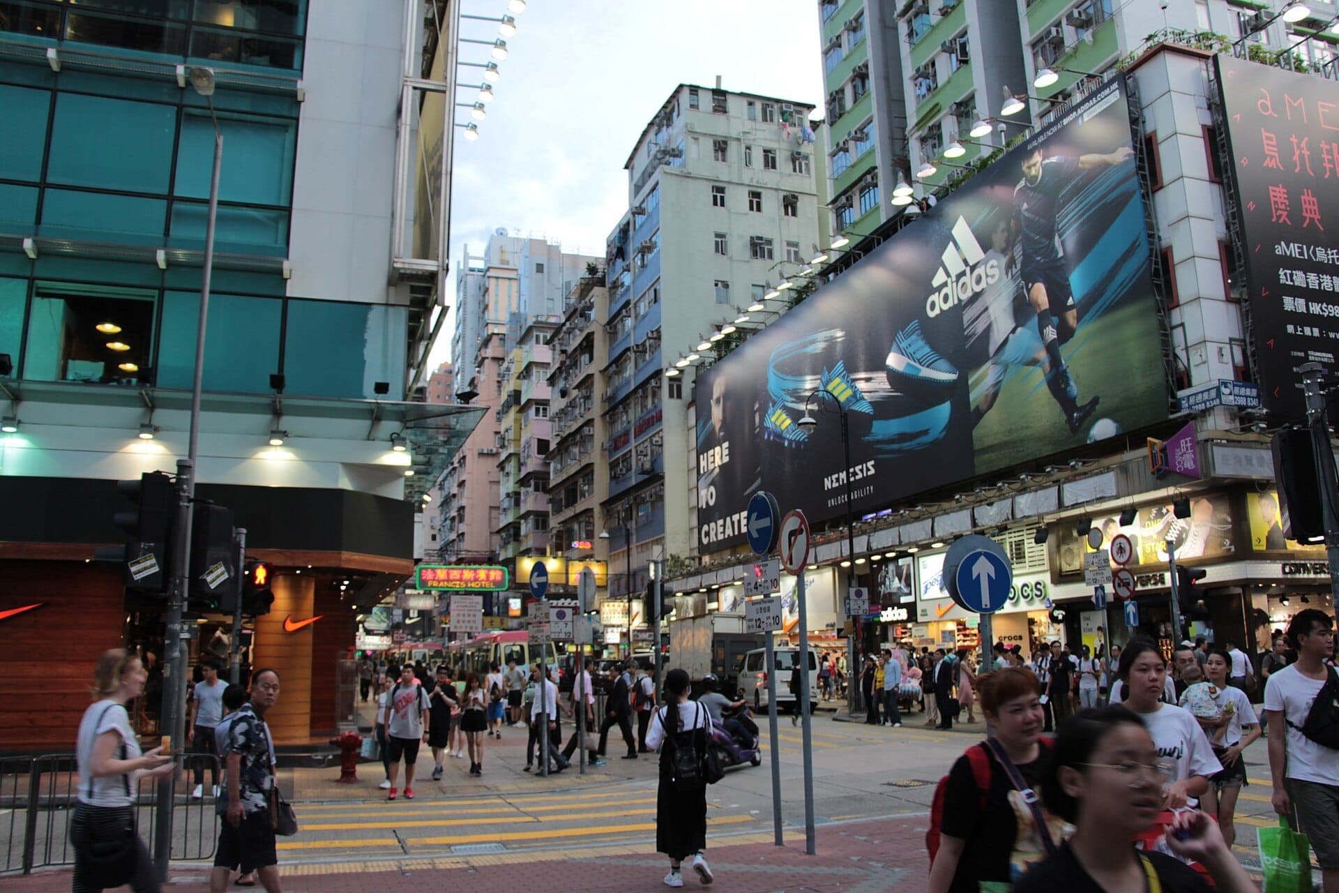 Busy Sneaker Street with many sneaker shops and shoppers in Mong Kok