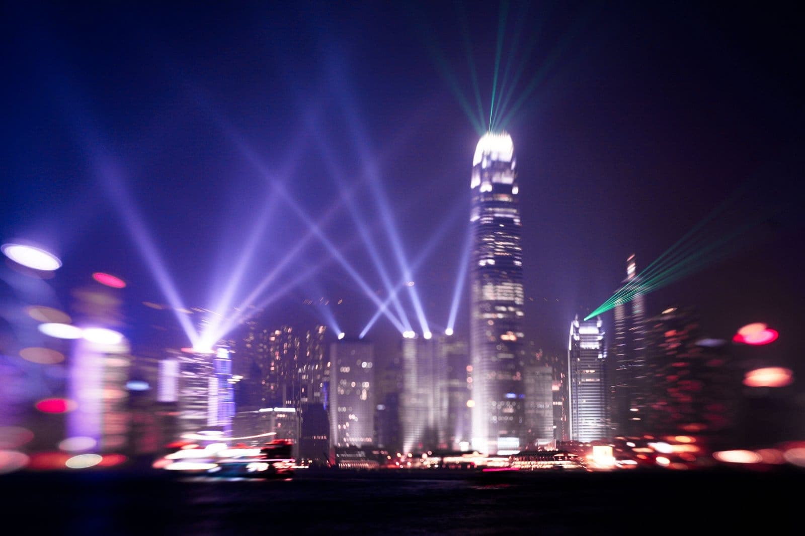 Vibrant Symphony of Lights illuminating Hong Kong's Victoria Harbour skyline with lasers, searchlights, and colorful building displays every night.