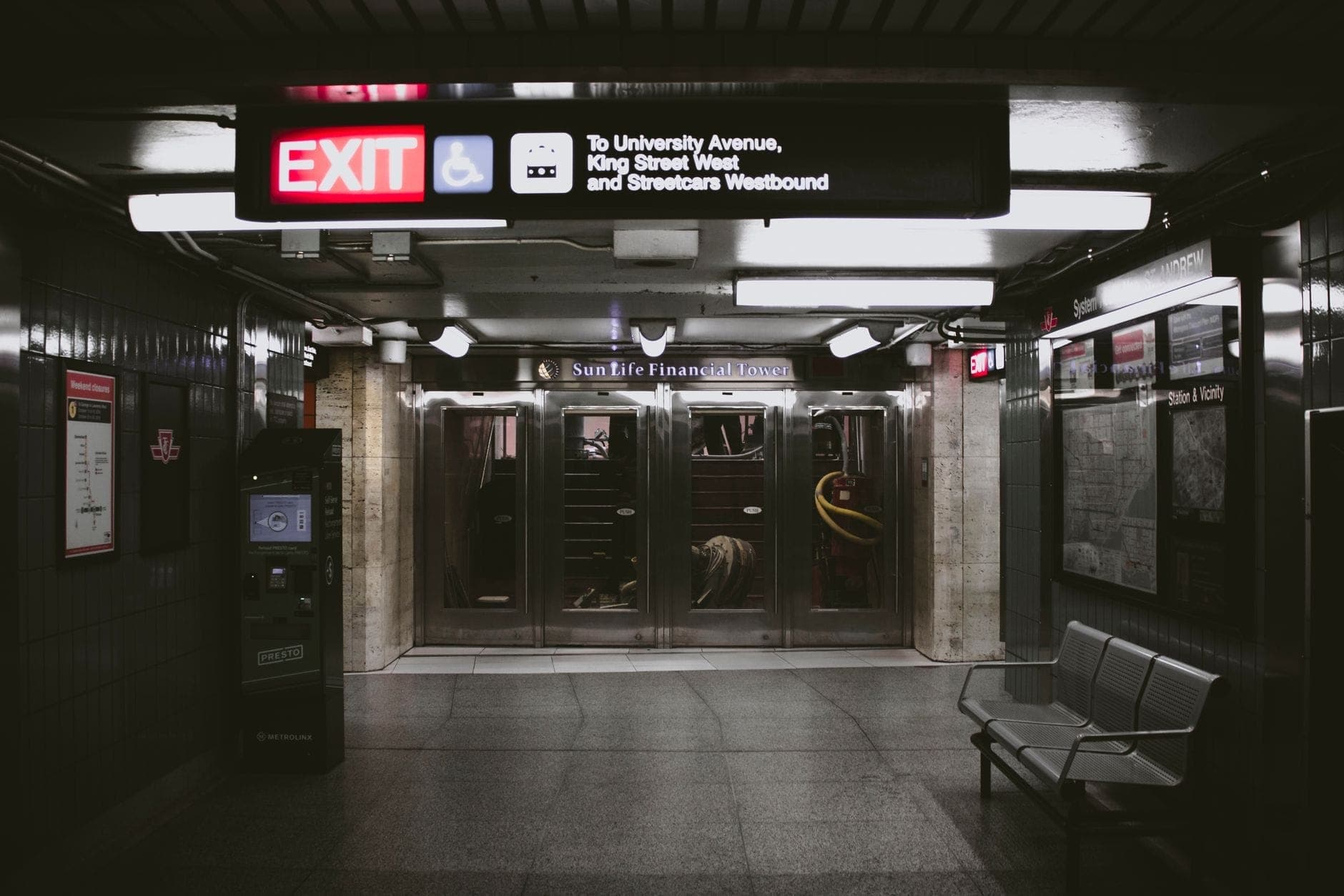 A clean, modern underground walkway with signage for University Avenue and King Street West, typical of Toronto's downtown pedestrian network.