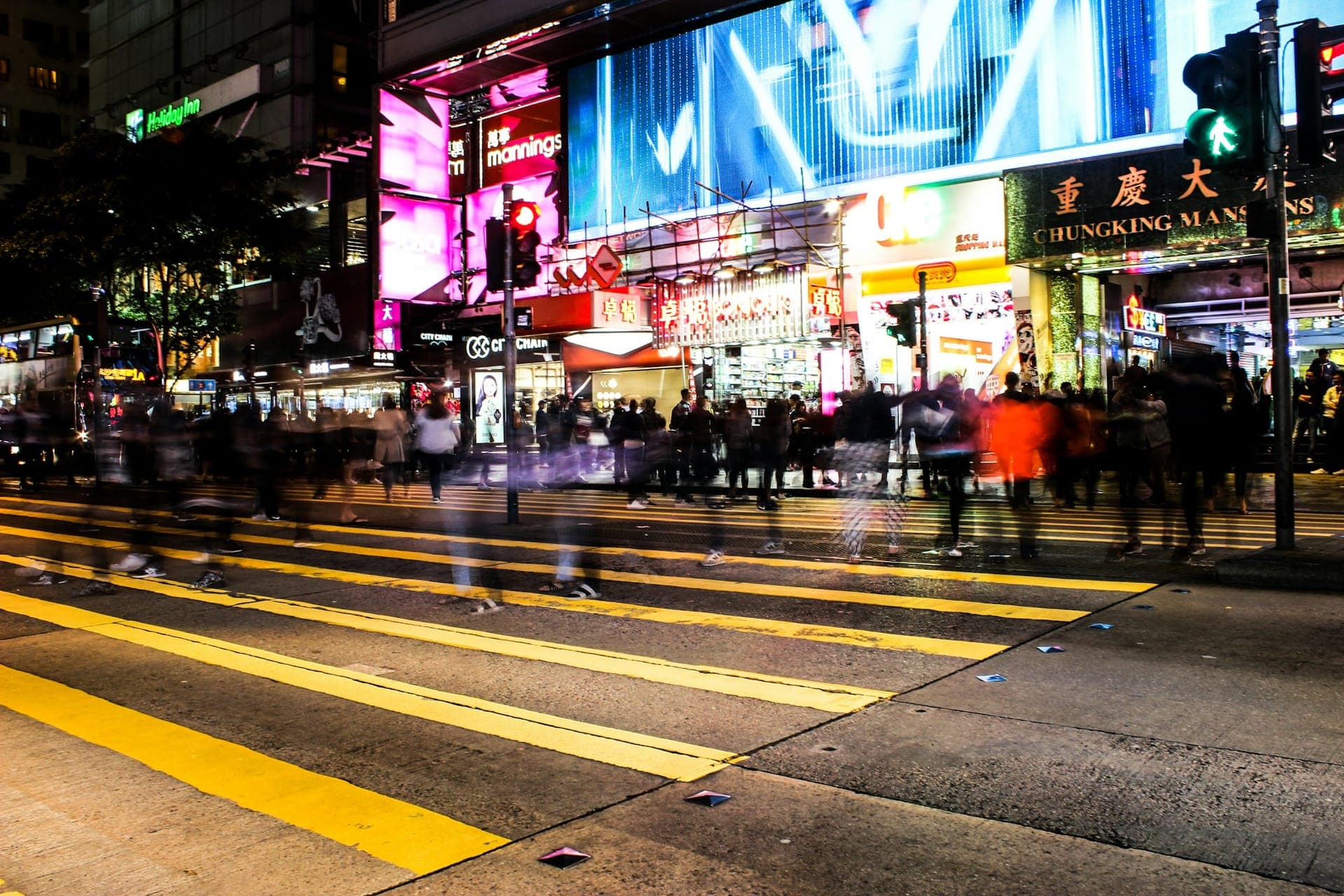 Busy Nathan Road in Tsim Sha Tsui near hotels and shopping areas at night