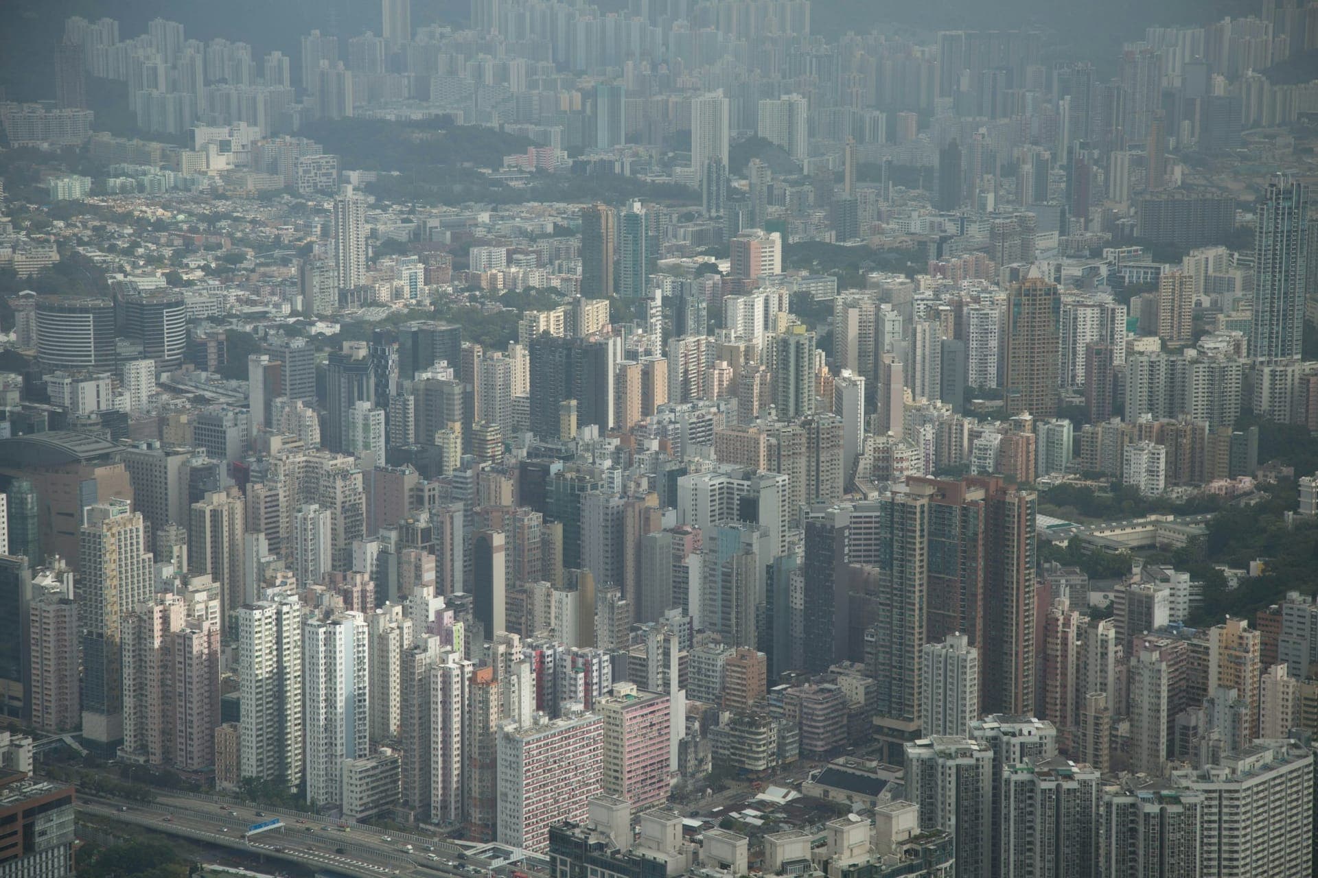 High-rise residential neighborhoods across Hong Kong showing urban density