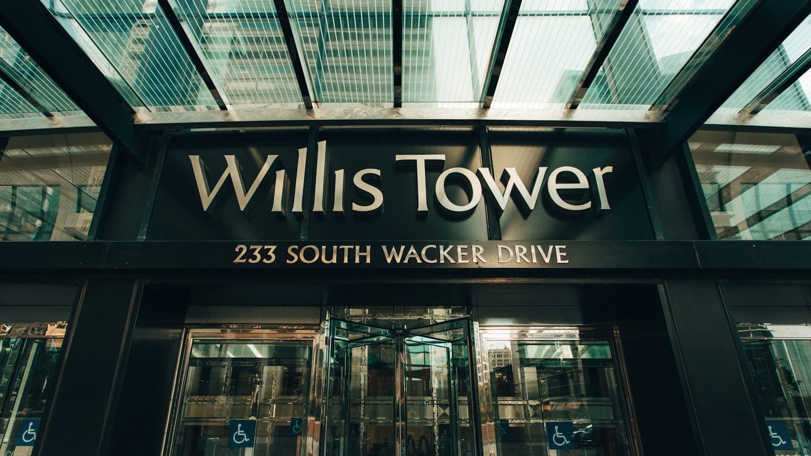 Entrance to Willis Tower at 233 South Wacker Drive with building name clearly displayed above the doors