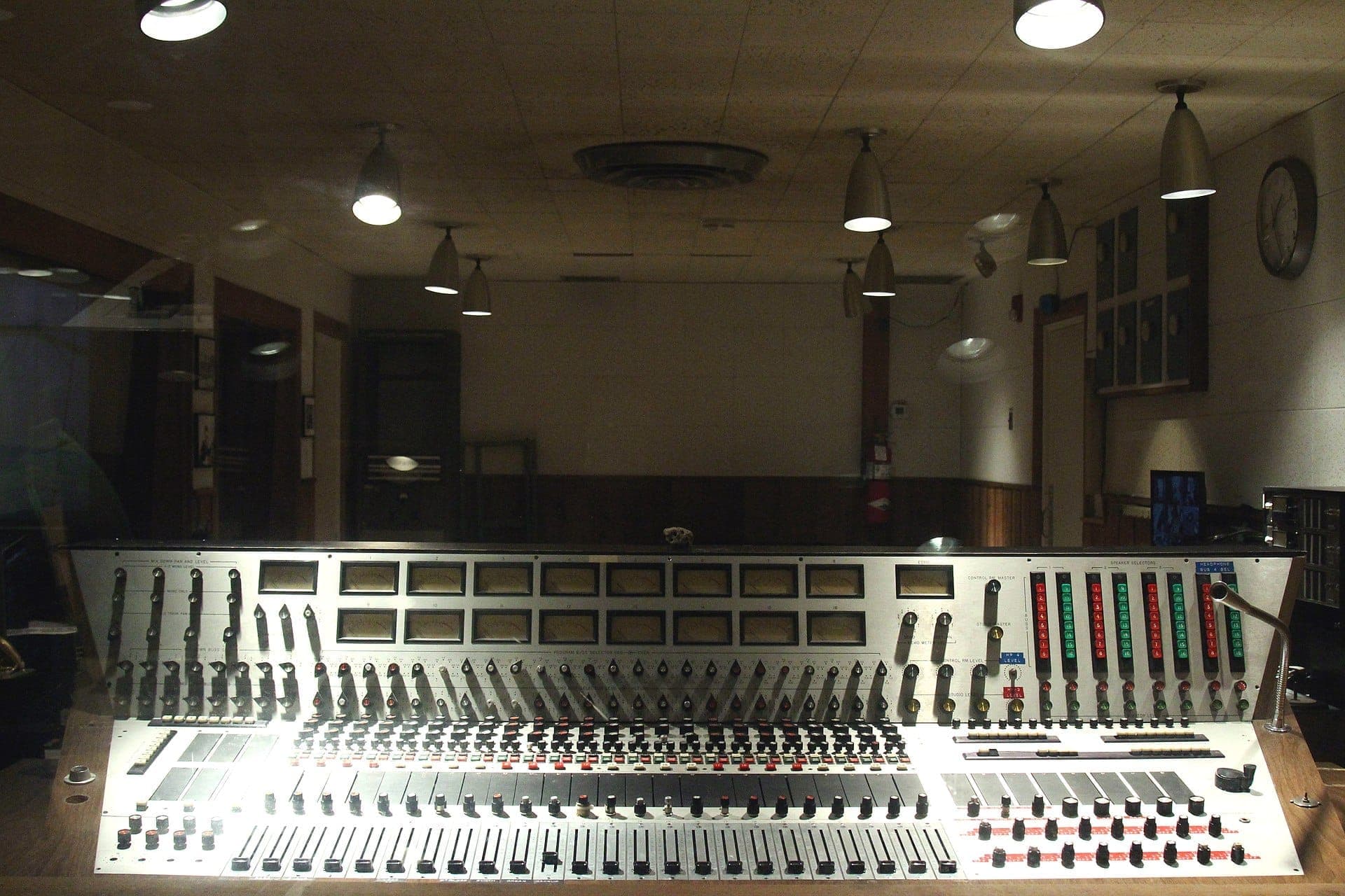 Vintage soundboard and analog controls inside RCA Studio B, Nashville's legendary recording studio with dim lighting and historic details.