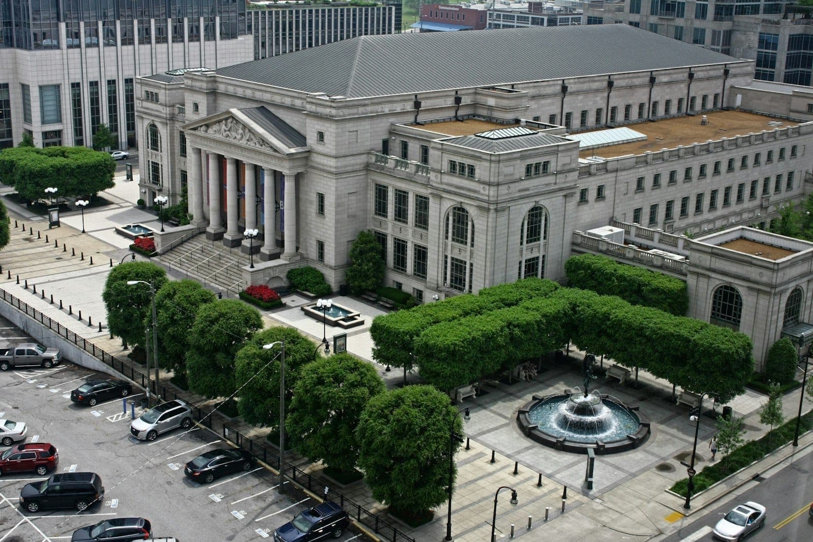 Aerial view of Schermerhorn Symphony Center showing its neoclassical architecture, front plaza, fountain, and surrounding downtown Nashville buildings.